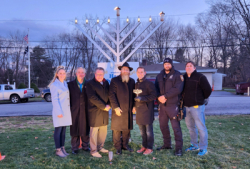 Yorktown Town Board officials and Town employees stand with Rabbi Yehuda Heber at Yorktown’s annual menorah lighting ceremony.